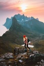 Traveler woman hiking alone on a trail in Norway outdoor travel summer vacations healthy lifestyle active girl with backpack Royalty Free Stock Photo