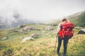 Traveler Woman hiking in foggy mountains Royalty Free Stock Photo