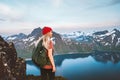 Traveler woman hiking outdoor in Norway with backpack, girl enjoys a healthy lifestyle and mountains view travel adventure Royalty Free Stock Photo