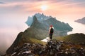 Traveler woman hiking solo in mountains of Norway outdoor activity travel summer vacations healthy lifestyle Royalty Free Stock Photo