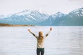 Traveler woman raised hands enjoying mountains view Royalty Free Stock Photo