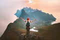 Traveler woman raised hands hiking alone on mountain top outdoor travel summer vacations healthy lifestyle active girl Royalty Free Stock Photo