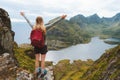 Traveler woman raised hands hiking alone on mountain top outdoor travel summer vacations Royalty Free Stock Photo