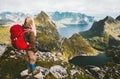 Traveler woman with red backpack hiking in mountains Royalty Free Stock Photo