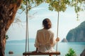 Traveler woman relaxing on swing above Andaman 2 Royalty Free Stock Photo