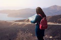 Traveler woman searching right direction on map