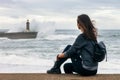 Traveler woman sightseeing lighthouse ocean landscape in Porto