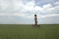 Traveler woman walks in the middle of nature looking into the future Royalty Free Stock Photo