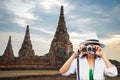 Traveler women covering her face with the camera