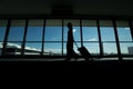 Traveler women and luggage at airport terminal