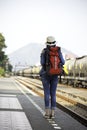 Traveler women walking alone Carrying luggage and waits train