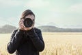 Young taking photograph with rice fields background Royalty Free Stock Photo