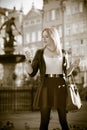 Traveler young woman with smart phone old town Gdansk Royalty Free Stock Photo