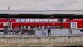 Travelers crowd an exit staircase at a train station in Germany