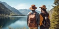 Travelers couple look at the mountain lake. Travel and active life concept with team. Adventure and travel in the mountains region Royalty Free Stock Photo