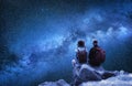 Travelers couple look at the stars. Travel and active life concept with team. Royalty Free Stock Photo