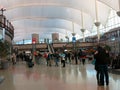 Travelers Embrace in Denver Airport (DIA) Lobby