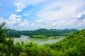 Travelers enjoy the beauty of nature on their summer vacation on bamboo raft.