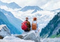 Travelers enjoy the view of the mountain valley. Travel and active life concept with team. Adventure and travel Royalty Free Stock Photo