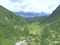 Travelers going hiking on mountainious path. Mountainious panorama