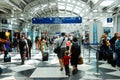 Travelers make their way through a maze of corridors at the airport