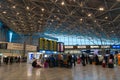 Travelers in departure terminal at Helsinki International Airport, Finland