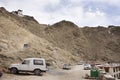 Travelers people and driver stop car in parking at Leh Stok Palace at Leh Ladakh Village winter season in Jammu and Kashmir, India Royalty Free Stock Photo