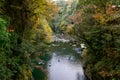 Travelers on a rowing boat at Takachiho Gorge in Kyushu