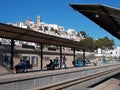 Travelers at Altea Spain station waiting for train