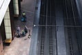 Travelers with suitcases walk around Antwerp Railway Station