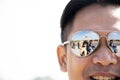 Travelers thai people men and women portrait posing for take photo from reflection of sunglasses at Red Fort of ancient Delhi city