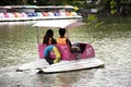 Travelers thai people spinning pedal boats in pond at garden