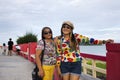 Travelers thai senior mother and young daughter women travel visit and posing portrait for take photo on Saphan saranwithi red