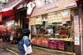 Travelers thai woman selecting and buy food from local restaurant in Hong Kong, China