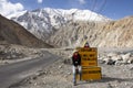 Thai woman visit and pose portrait for take photo with Milestone on Pangong lake road at Leh Ladakh in Jammu and Kashmir, India