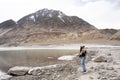 Travelers thai woman travel visit and posing portrait for take photo at view point of Confluence of the Indus and Zanskar Rivers Royalty Free Stock Photo