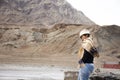Travelers thai woman travel visit and posing portrait for take photo at view point of Confluence of the Indus and Zanskar Rivers Royalty Free Stock Photo