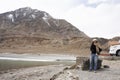 Travelers thai woman travel visit and posing portrait for take photo at view point of Confluence of the Indus and Zanskar Rivers Royalty Free Stock Photo