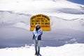 Travelers thai women visit travel and posing at top of the world of Khardung La Road in Himalaya mountain at Leh Ladakh in India