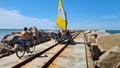 Travelers visiting the breakwater at Cassino beach, in Rio Grande do Sul, Brazil. February 2023