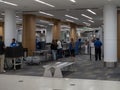 Travelers wait in line at a TSA terminal security checkpoint at San Francisco International Airport