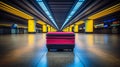 Travelers waiting for luggage at baggage claim carousel in airport terminal, transportation concept Royalty Free Stock Photo