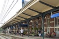 Travelers waiting on train in railway station Hoorn
