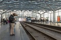 Travelers waiting for the tram at the central Station of The Hague, The Netherlands