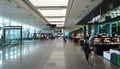 Travelers Walking Along An Airport Corridor