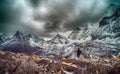 Travelers walking with snow capped mountain background to Milk Lake and Five colors lake in Yading Nature Reserve