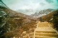 Travelers walking with snow capped mountain background to Milk Lake and Five colors lake in Yading Nature Reserve