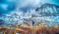 Travelers walking with snow capped mountain background to Milk Lake and Five colors lake in Yading Nature Reserve