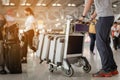 Travelers are walking to drag luggage in modern airport terminal to travel to new places.