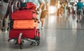 Travelers are walking to drag luggage in modern airport terminal to travel to new places. Royalty Free Stock Photo